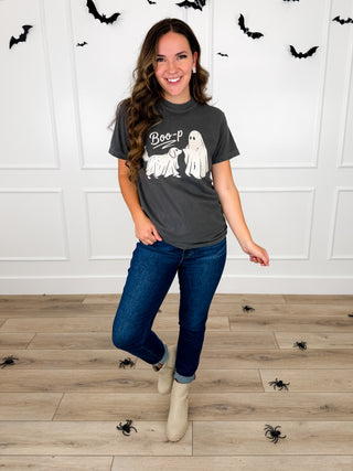 Model wears a grey Boo-p ghost and dog graphic tee with Judy Blue Kyla jeans and cream booties.