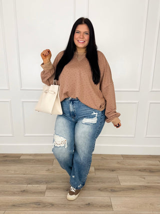 Camel-brown swiss-dot pullover and blue ripped knee jeans outfit