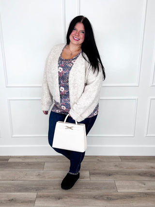 Floral print tank layered under an oatmeal cardigan with Judy Blue Kyla jeans and black booties.
