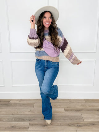 Lavender striped chunky knit sweater with blue flare jeans