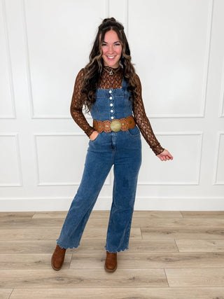 Medium-wash denim jumpsuit with brown lace mesh long-sleeve overlay