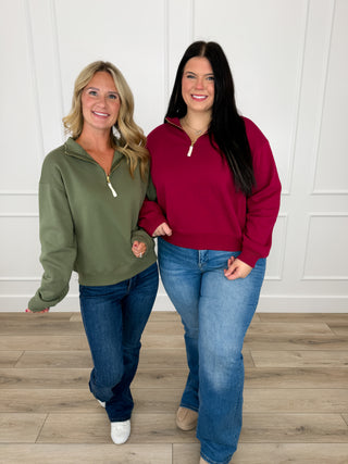 Olive and wine quarter zip pullovers paired with Judy Blue Cali bootcut and Risen Mira flare jeans.