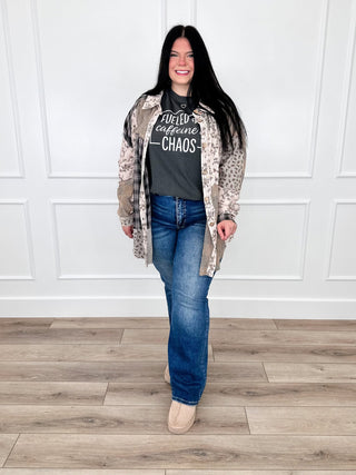 Patchwork tunic over black graphic tee with blue jeans, long open-front beige-gray knit