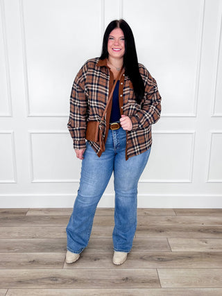 Brown and blue plaid button up top layered over a navy cami with Risen Lola straight leg jeans.