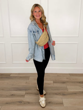 Light-wash denim hoodie jacket with hood over red tank, worn with black leggings and sneakers