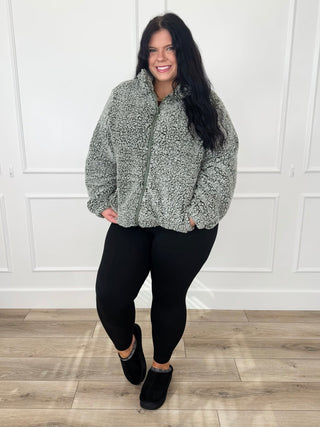 Sage green sherpa jacket and black leggings outfit, full-body