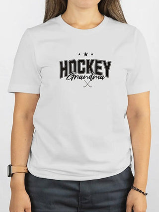White cotton-blend short-sleeve graphic tee with “HOCKEY Grandma” and crossed sticks