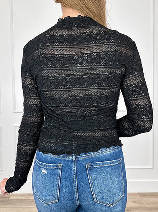 Black sheer mesh long-sleeve top with patterned yoke on back, ruched stretch fit