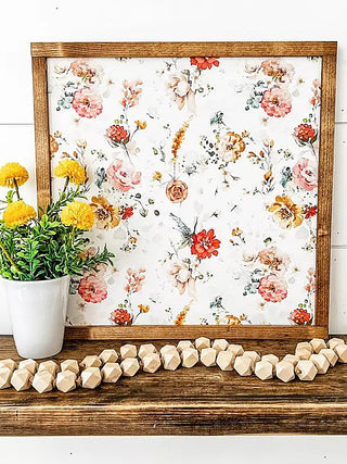 Wood hanging decor with colorful floral print in a dark wood frame