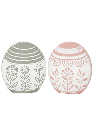 Set of 2 whitewashed wood decorative eggs with floral line art, one green and one pink