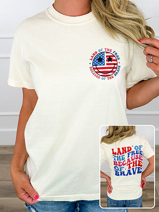 Cream cotton crewneck short-sleeve graphic tee with circular front logo and back text inset