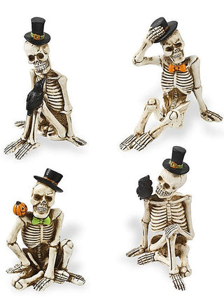 Resin skeleton decor figurine with black top hat, broom raised, seated pose
