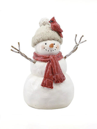 Resin snowman decoration with red scarf, twig arms, and bird-topped hat