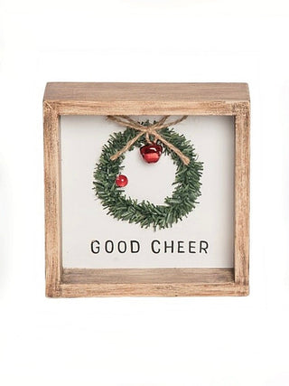 Wood framed wreath decor with pine greenery and 'GOOD CHEER' text.