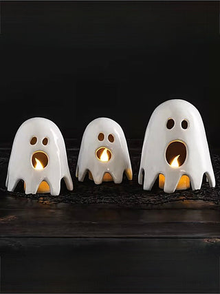 Ceramic ghost figurine set of three, white with gold glowing candle eyes