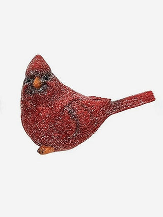 Glittered red resin bird figurine, side view with raised beak and tail