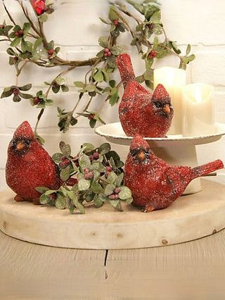 Glittered red resin bird figurine with pointed tail, perched on small feet