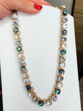 Gold-tone necklace with round iridescent stones and white pearl-like beads