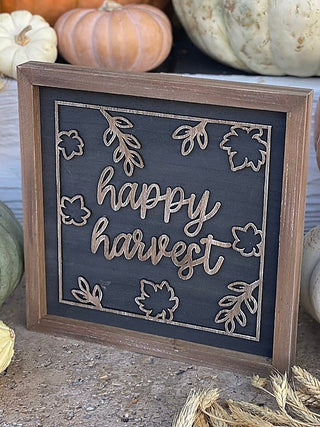 Wood-framed Happy Harvest sign with 'happy harvest' script and leaf cutout design
