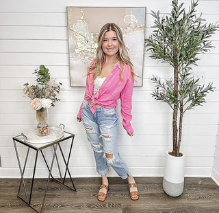 Pink cotton long-sleeve button-up top with tied front