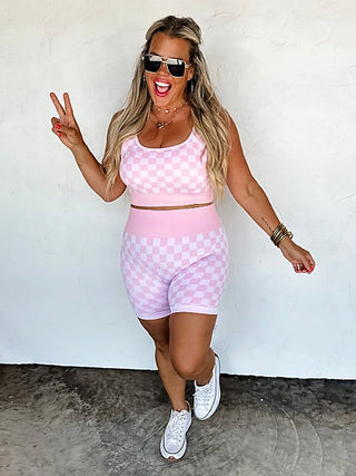 Pink checkered lounge set with high-rise shorts and matching cropped tank