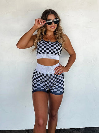 Black-and-white checkered lounge set with high-rise shorts and cropped tank