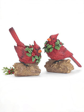 Pair of red cardinal resin decor on textured tree stumps with green berry accents