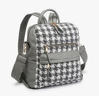 Houndstooth faux leather backpack with grey faux leather trim and dual zip front pockets