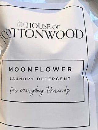 Moonflower laundry detergent refill pouch, white label on light bag with screw cap