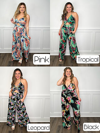 Sleeveless pink floral jumpsuit with wide-leg pants and tie waist