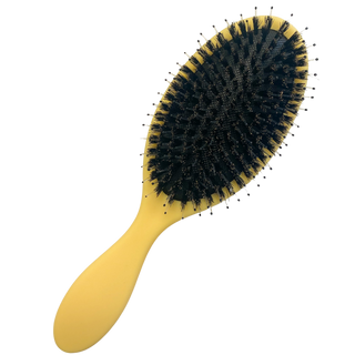 Yellow hair brush with round dark bristle head and oval handle.