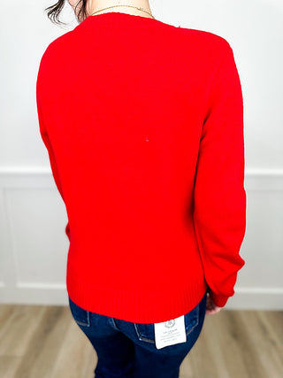 Red knit sweater back view, long sleeves, ribbed crew neck and cuffs