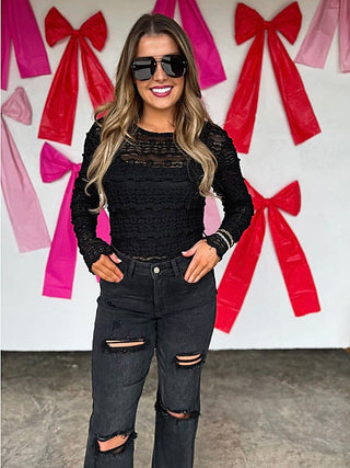 Black lace long-sleeve top with textured knit pattern and round neckline