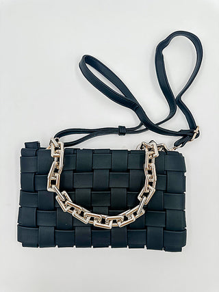 Woven faux leather crossbody bag in dark navy with silver chain and buckle straps