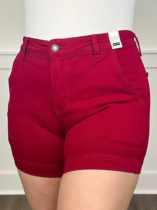 High-rise wine red denim shorts with back patch pockets and button waistband