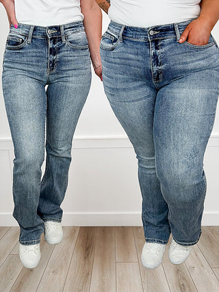Light-wash mid-rise bootcut jeans with belt loops, no distressing, five-pocket style