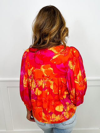 Fuchsia pink rayon blend top with abstract print, 3/4 sleeves, back pullover.