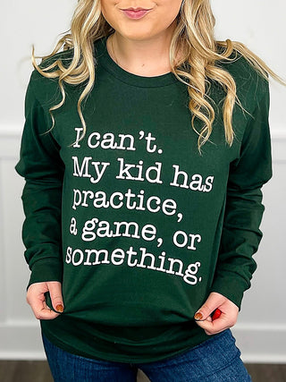 Kids dark green long-sleeve graphic T-shirt with large “I can’t. My kid has practice...” quote