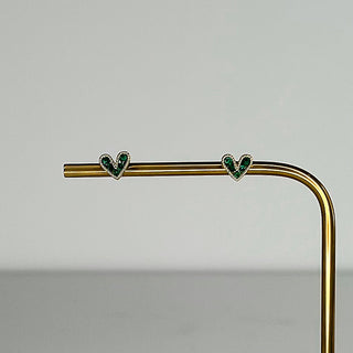 Gold-tone heart stud earrings with two green crystal hearts along a straight bar