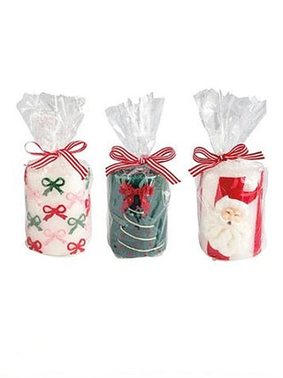 Set of three holiday candles, clear wrap with red ribbon and festive printed labels