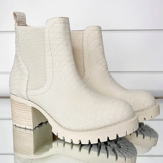 Ivory faux leather Chelsea booties with chunky tread sole