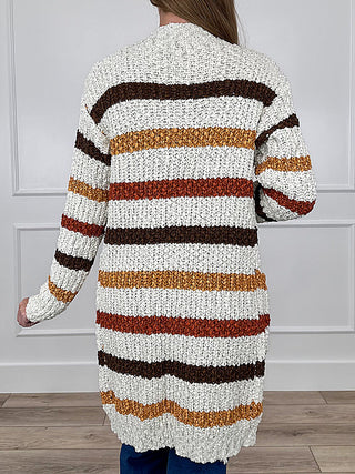 Ivory long-sleeve knit cardigan with striped back panel bands in brown and orange