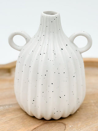 White ceramic vase with scalloped shape and small dot pattern, two side handles