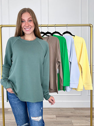 Forest green ribbed long sleeve weekender top with crew neck and raglan sleeves