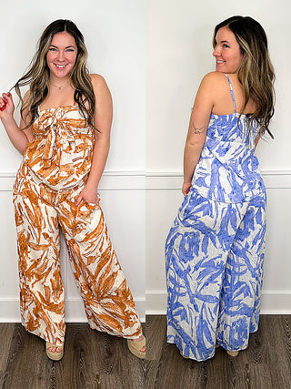 High-rise patterned palazzo pants with wide legs; orange-and-white and blue-and-white styles