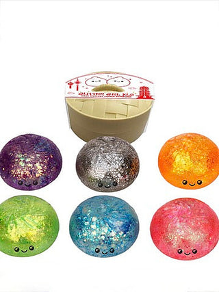 Glitter dumpling squishy set with 6 colorful round squishies and a beige tray