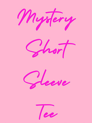Pink graphic short-sleeve tee with cursive text: “Mystery Short Sleeve Believe Tee”
