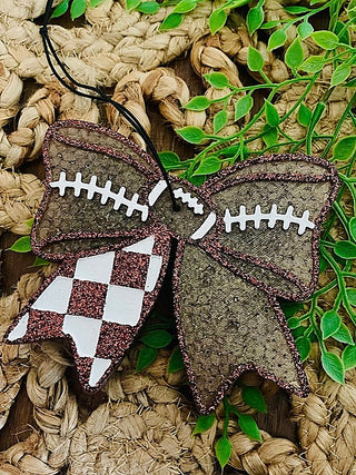 Glitter sideline freshie bow with dark football shape, white lacing and checker details