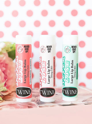 Large CBD lip balm tubes, Vanilla and Mint shades visible, three-pack.