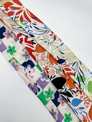 Multipurpose scarf with floral and leaf print, multicolor accents on cream background